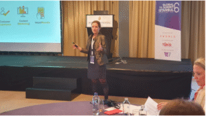 Speaker presenting on stage at the 6th Global PR Summit in Istanbul